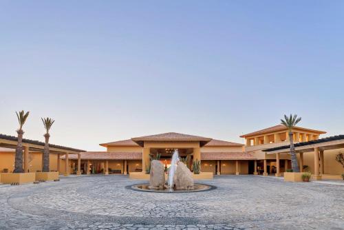 a courtyard with a fountain in the middle of a building at Grand Fiesta Americana Los Cabos All Inclusive Golf & Spa in Cabo San Lucas