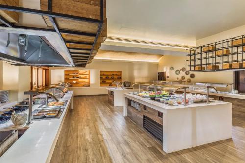 a large kitchen with a lot of food at Grand Fiesta Americana Los Cabos All Inclusive Golf & Spa in Cabo San Lucas