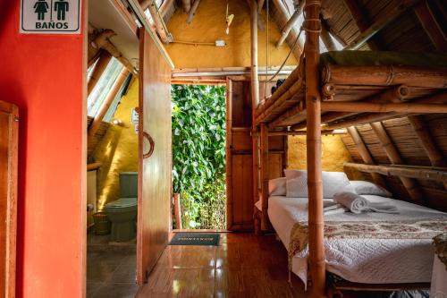 Postel nebo postele na pokoji v ubytování Chalet Ecoturismo La Nohelia