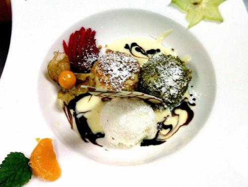 a white bowl filled with food on a table at Narnhoferwirt in Sankt Jakob im Walde