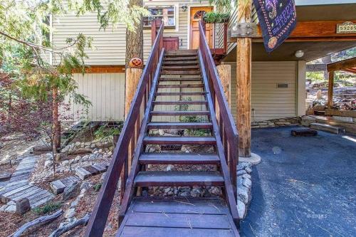 a set of stairs leading to a house at CASA de los ARBOLES! Delight & Solitude Abound! in Pine Cove