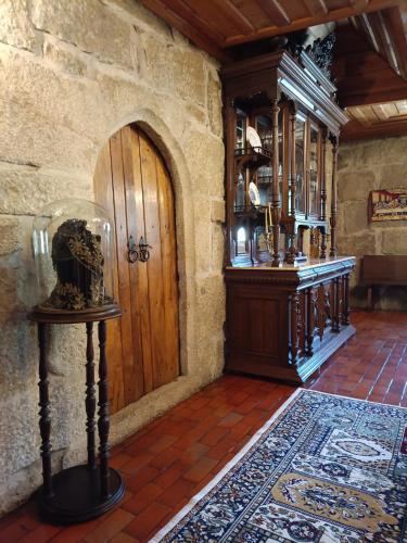 a room with a wooden door and a wooden floor at Castelo de Portugraal in Vilela