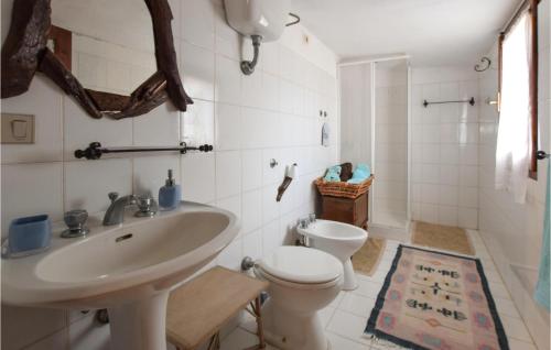 a bathroom with a sink and a toilet at 3 Bedroom Cozy Home In Sedini in Sedini