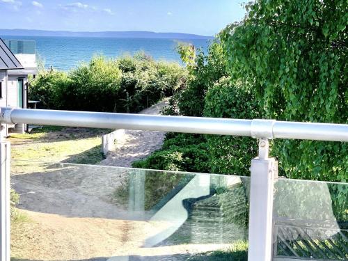 a view of the ocean from the balcony of a house at 6 person holiday home in HALMSTAD-By Traum in Halmstad