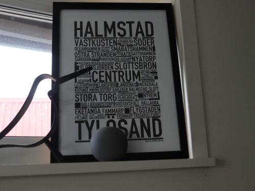 a framed poster of a tennis ball in a window at 6 person holiday home in HALMSTAD-By Traum in Halmstad