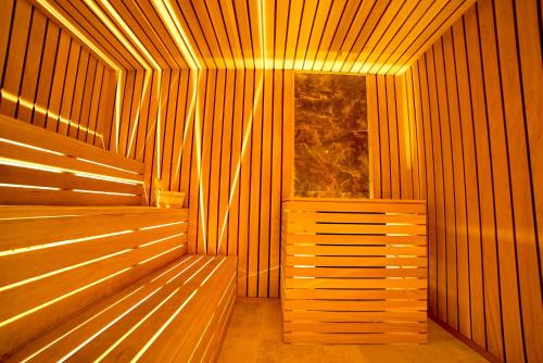 a sauna with wooden benches and a window at Bucium Motel & SPA in Iaşi