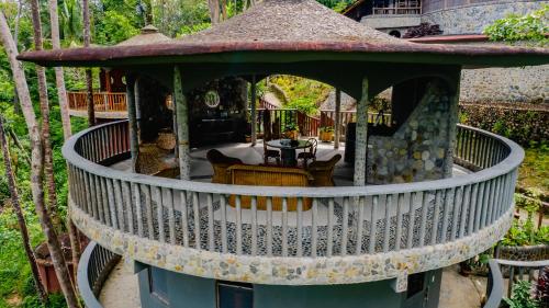 an external view of a house with a gazebo at Atremaru Jungle Retreat in Puerto Princesa City