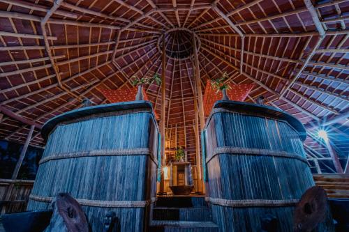 two blue barrels in a room with a ceiling at Atremaru Jungle Retreat in Puerto Princesa City