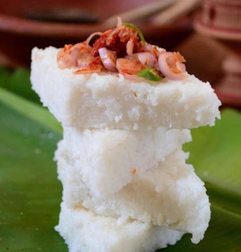 a piece of cake with shrimp on top of it at Blooming polhena in Matara