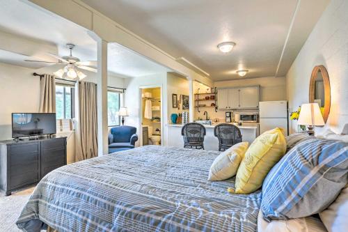 a large bedroom with a bed and a kitchen at Peaceful Prescott Studio with Mountain Views! in Prescott