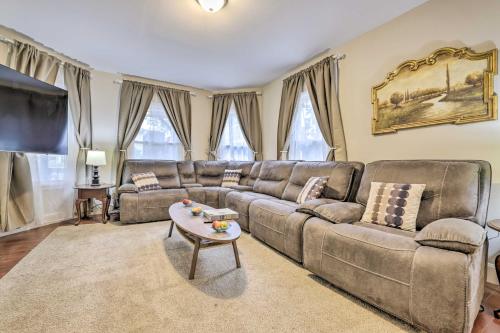 a living room with a couch and a table at Cozy Springfield Apartment, Close to Parks! in Springfield