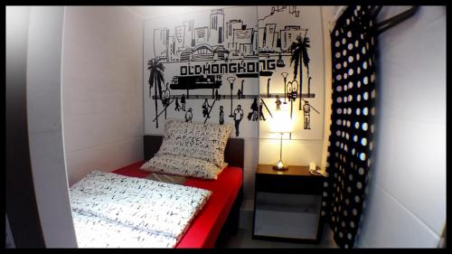 Łóżko lub łóżka w pokoju w obiekcie Micro Hotel