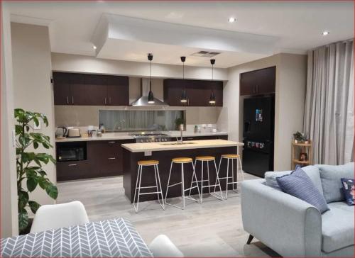 A kitchen or kitchenette at Newly built cozy double storey 3 bed room house at Prospect.