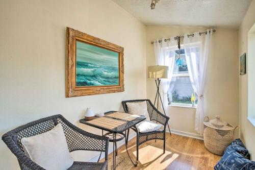 a living room with a table and chairs and a window at Charming Seaview Home with BBQ, Deck and Fire Pit in Seaview