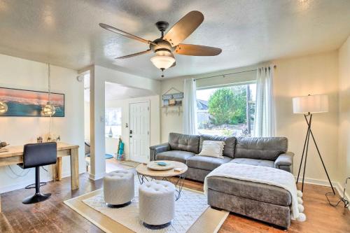 a living room with a couch and a ceiling fan at Charming Seaview Home with BBQ, Deck and Fire Pit in Seaview