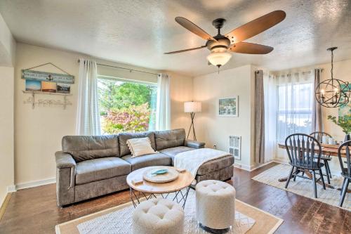 a living room with a couch and a table at Charming Seaview Home with BBQ, Deck and Fire Pit in Seaview