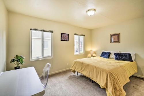 a bedroom with a bed and a table and window at Cozy Mountain View Apt Near Downtown San Jose in Mountain View