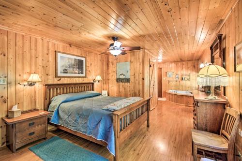 a bedroom with a bed and a wooden ceiling at Family Home with Stunning River and Mountain View in Priest River