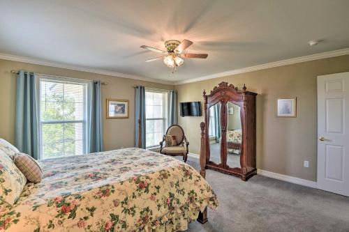 a bedroom with a bed and a ceiling fan at Peaceful Bellevue Gem on Working Cattle Ranch in Bellevue