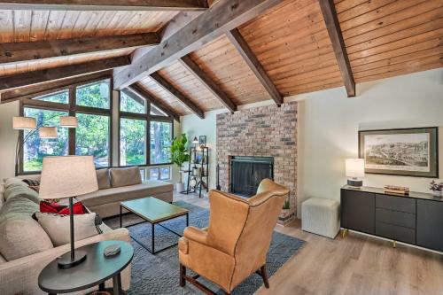 a living room with wooden ceilings and a fireplace at Near Hiking and Yuba River Nevada City Retreat! in Nevada City