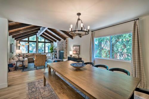 a dining room and living room with a table and chairs at Near Hiking and Yuba River Nevada City Retreat! in Nevada City