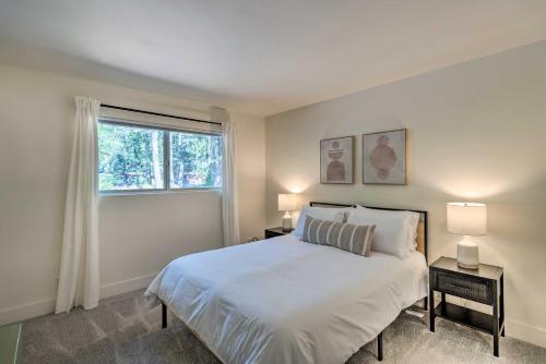a white bedroom with a bed and a window at Near Hiking and Yuba River Nevada City Retreat! in Nevada City