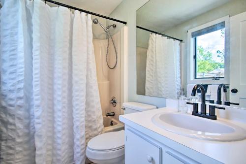 a bathroom with a sink and a toilet and a shower at 2 Mi to South Cape Beach State Park Home with Yard! in Mashpee