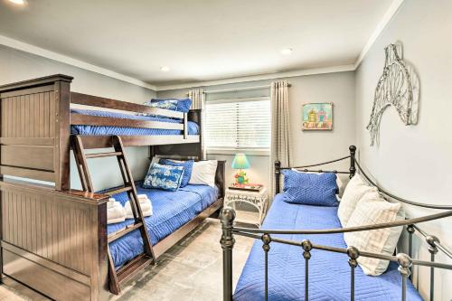 two bunk beds in a room with blue beds at Walk to Ocean Condo with Community Perks on HHI in Hilton Head Island