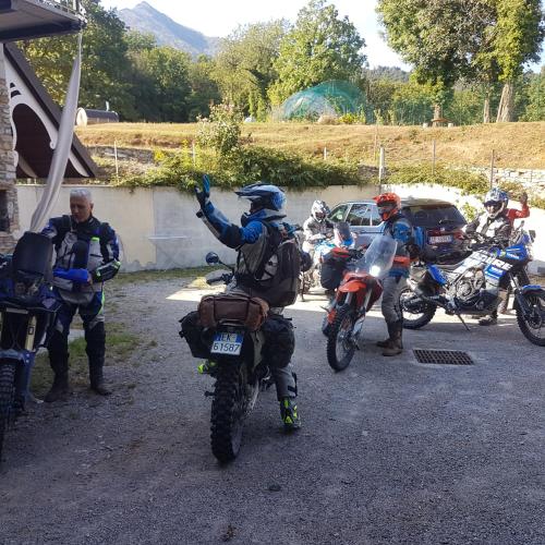 a group of motorcyclists standing around on their motorcycles at Alpuntogiusto in Peveragno
