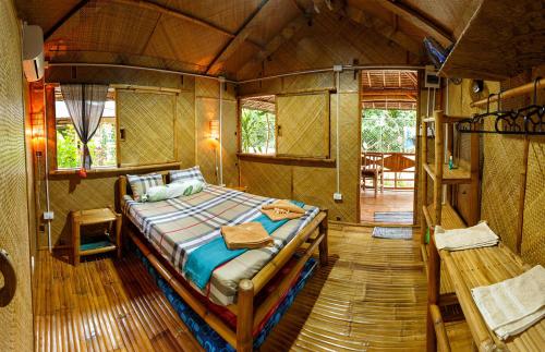 a bedroom with a bed inside of a tent at Camotes-Hidden-Huts in San Francisco