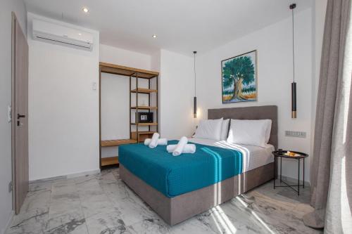 Posteľ alebo postele v izbe v ubytovaní Iconic Athens Suites