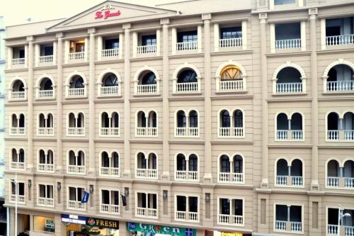 a large white building with a lot of windows at Comfortable & Lovely 1 Bed Apt In Bahria Town in Rawalpindi