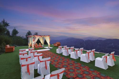 a row of chairs and a wedding ceremony on a hill at Fortune Park Kufri, Shimla - Member ITC Hotels' Group in Shimla