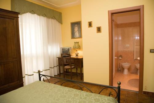 Кровать или кровати в номере B&B Podere Ospedaletto