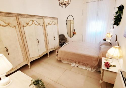 Katil atau katil-katil dalam bilik di Amantea Apartment The Shabby-Chic