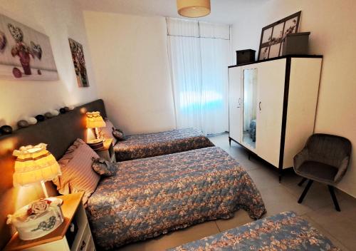 Katil atau katil-katil dalam bilik di Amantea Apartment The Shabby-Chic