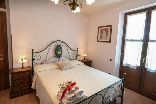 Ένα ή περισσότερα κρεβάτια σε δωμάτιο στο Agriturismo La Rocca Assisi