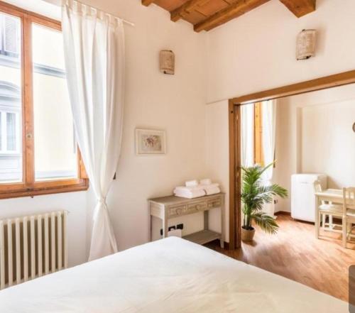 Un pat sau paturi într-o cameră la La Martinella