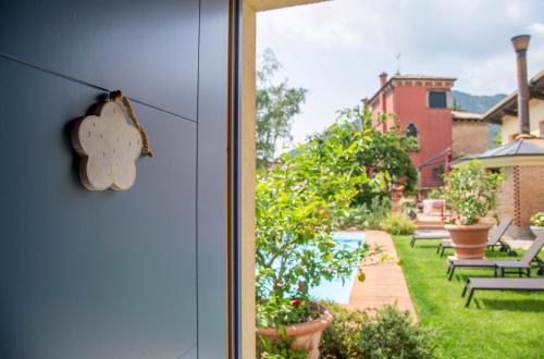 a house door with a cookie hanging on it at Hotel Calvi-Ristorante Mainor in Vittorio Veneto