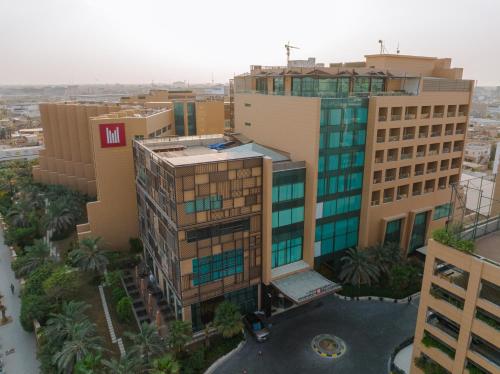 an overhead view of a city with tall buildings at Grand Millennium Al Seef Basra in Al Başrah