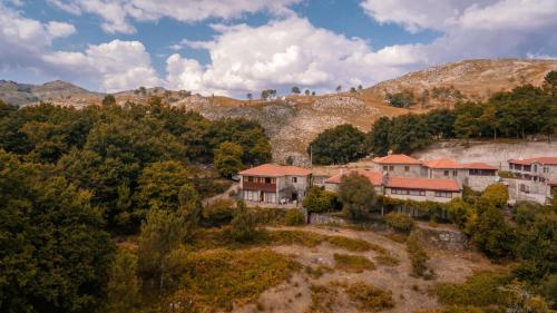an aerial view of a village in the mountains at Casa dos Peliteiros in Vilarinho