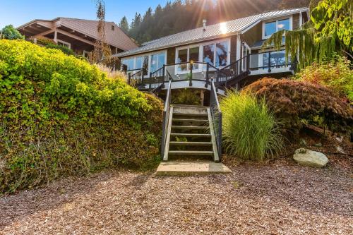 a house with a staircase leading up to a house at Whatcom By The Water in Bellingham