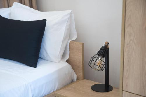 Ένα ή περισσότερα κρεβάτια σε δωμάτιο στο Minimal Culture Boutique Rooms