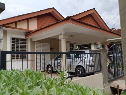 a car parked in front of a house at Park Villa Homestay in Sungai Petani
