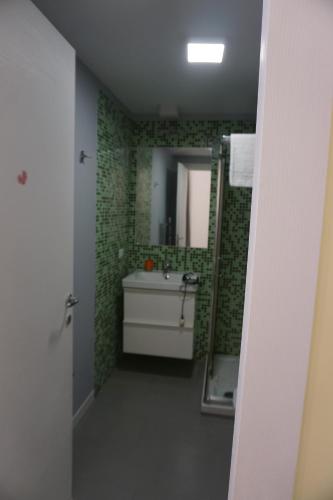 a bathroom with a sink and a mirror at Monteoliveto 5 in Naples