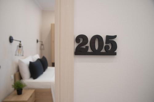 Ένα ή περισσότερα κρεβάτια σε δωμάτιο στο Minimal Culture Boutique Rooms