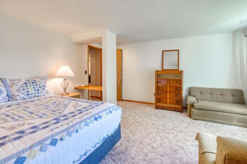 a bedroom with a bed and a couch and a chair at Bamboo House - Meredith Lodging in Nehalem