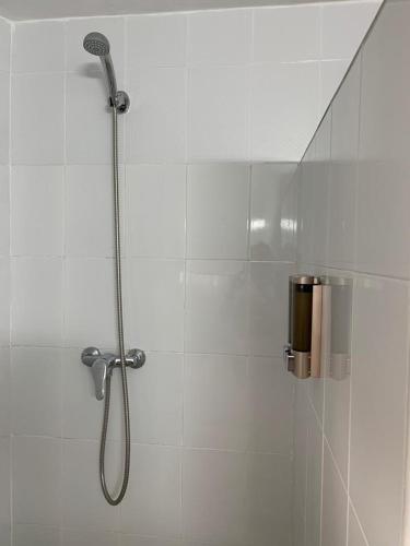 a shower with a glass door in a bathroom at La Casita de Mari in Estepona