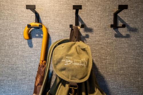 a bag is hanging on a wall at Hotel OTP Birkenhof in Bad Kleinkirchheim