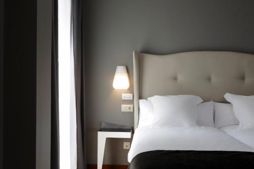 Letto o letti in una camera di Capitol Boutique Hotel